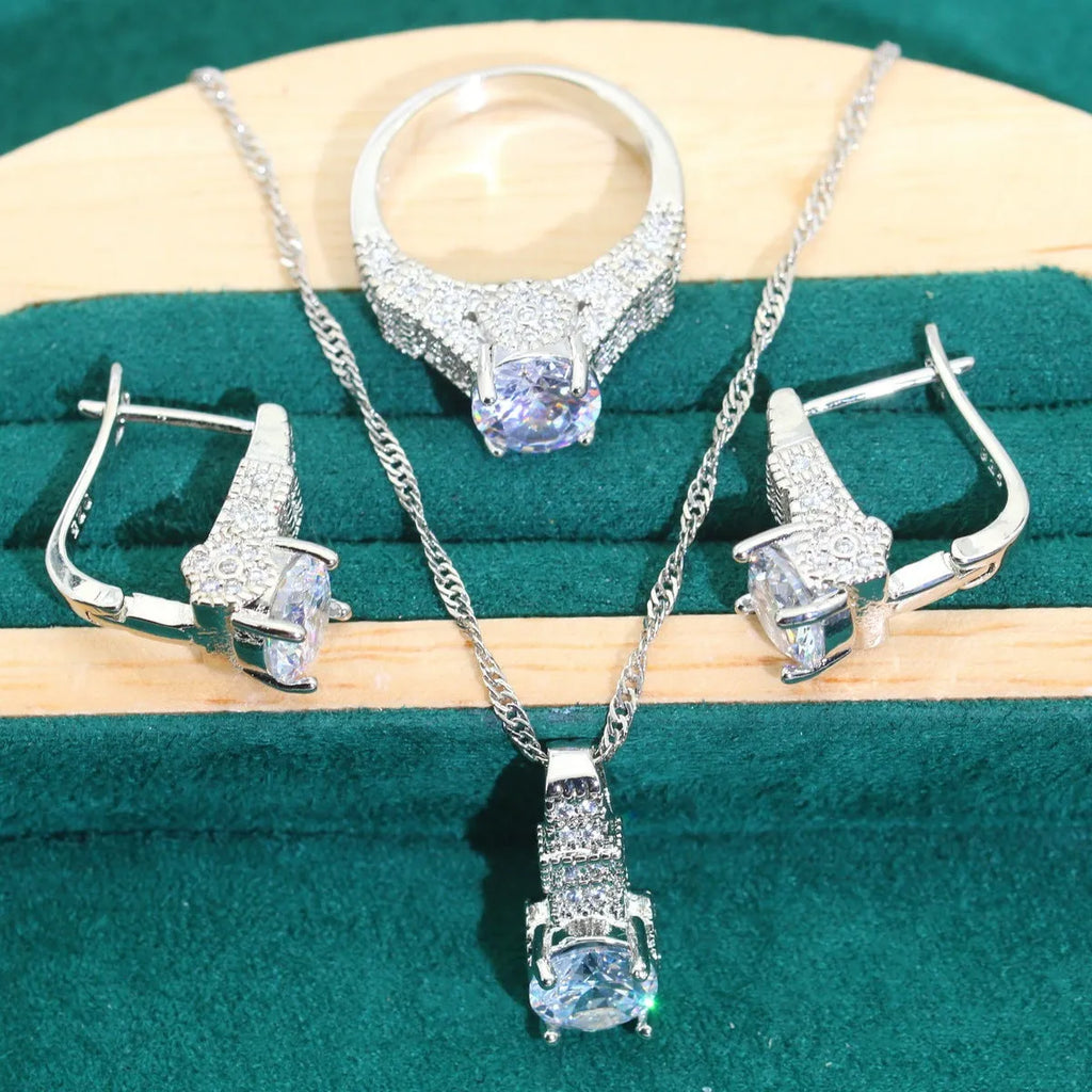 Four-piece bridal jewellery set showing zircon necklace, bracelet, earrings and ring with water wave chain design