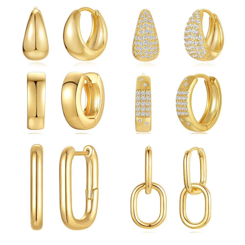 Geometric brass earclip earrings with round elements in golden and gold finishes