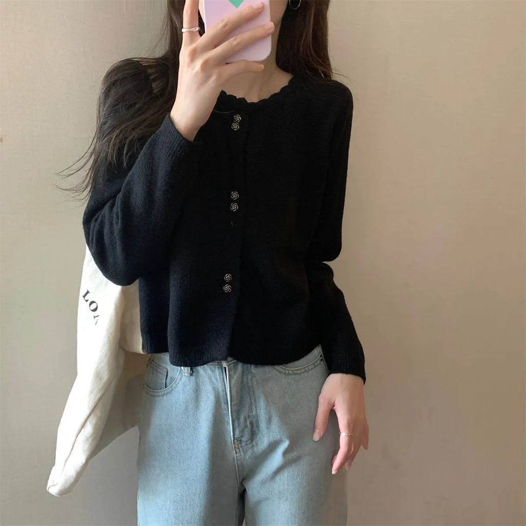 Women's milky white acrylic long-sleeve cardigan coat worn open, free size regular fit.