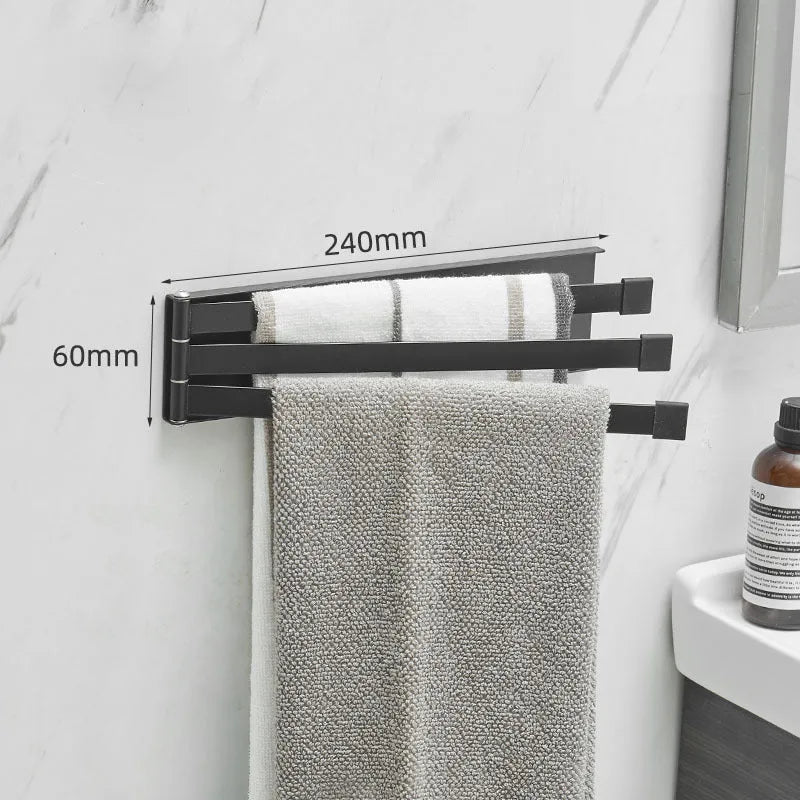 Nordic folding towel bar in black mounted on bathroom wall with towels hanging