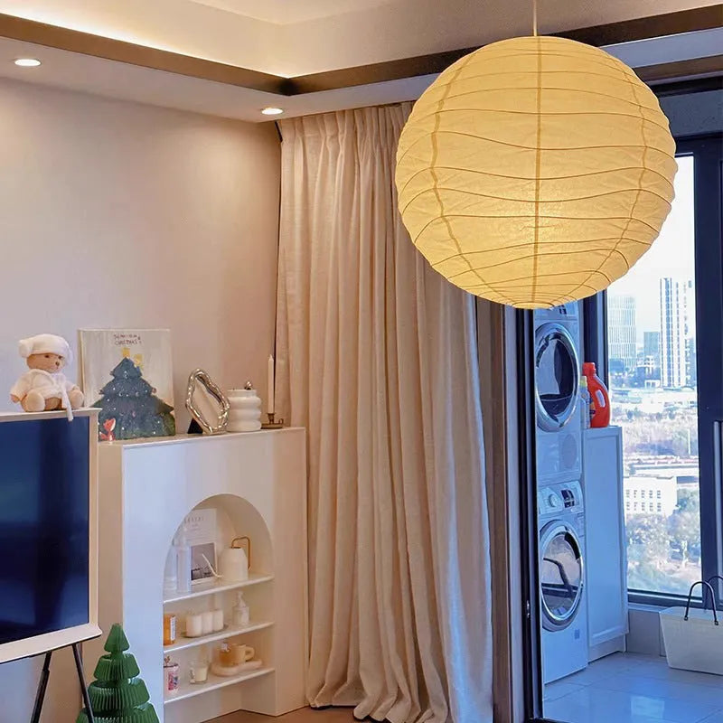 Japanese style rice paper ceiling chandelier lamp with a natural shade in a living room setting.