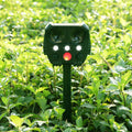 Green solar ultrasonic animal repellent with solar panel showing 12x13x5cm dimensions