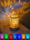 Rotating water ripple night light with acrylic dome on a solid wood base.