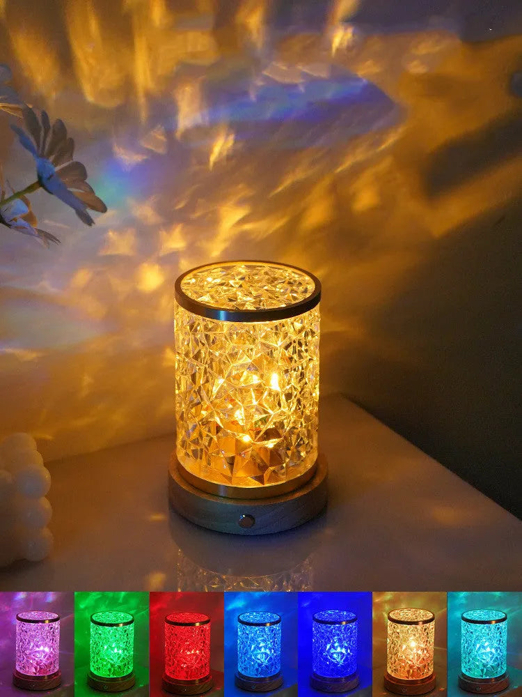 Rotating water ripple night light with acrylic dome on a solid wood base.