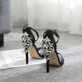 Black suede women's high heel shoes with rhinestone details and a pointed fishmouth toe.