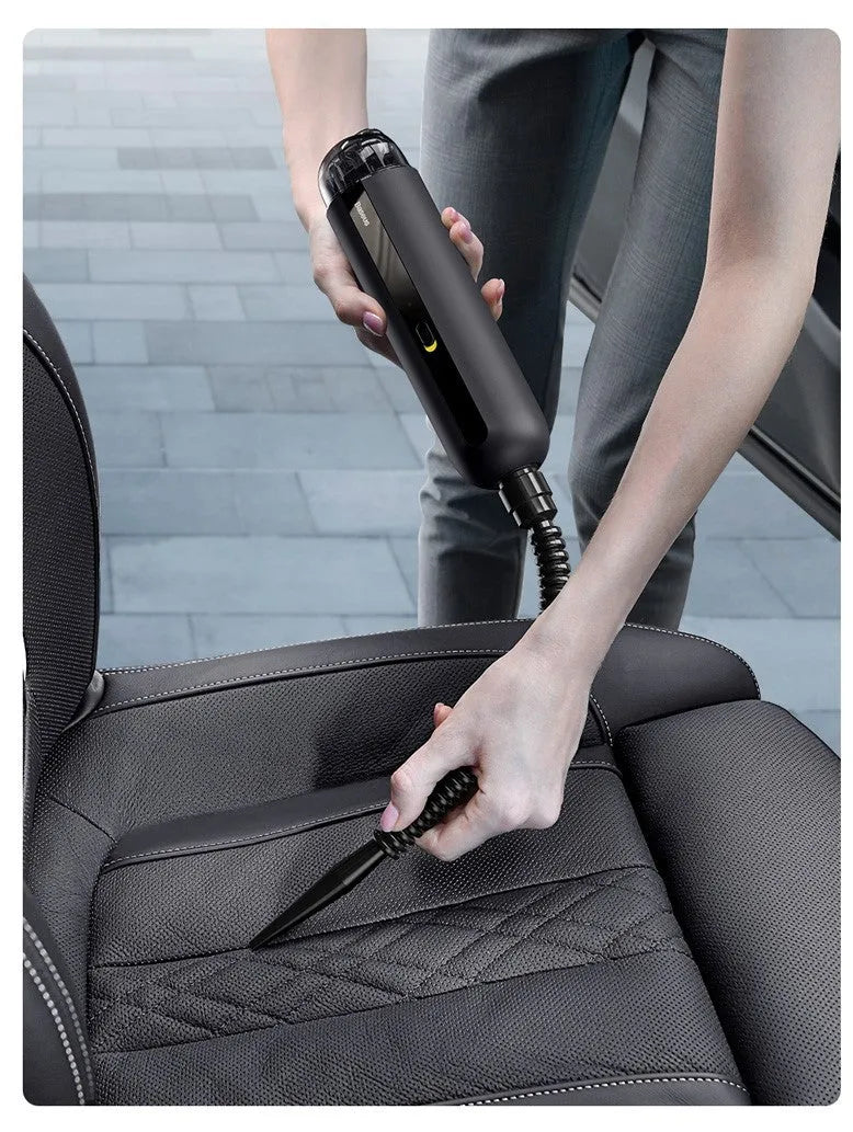 Black handheld wireless car vacuum cleaner with nozzle and blowing hose accessory
