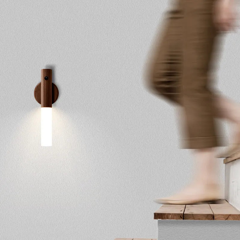 Smart sensor LED desk lamp in wood and acrylic glass on a desk.