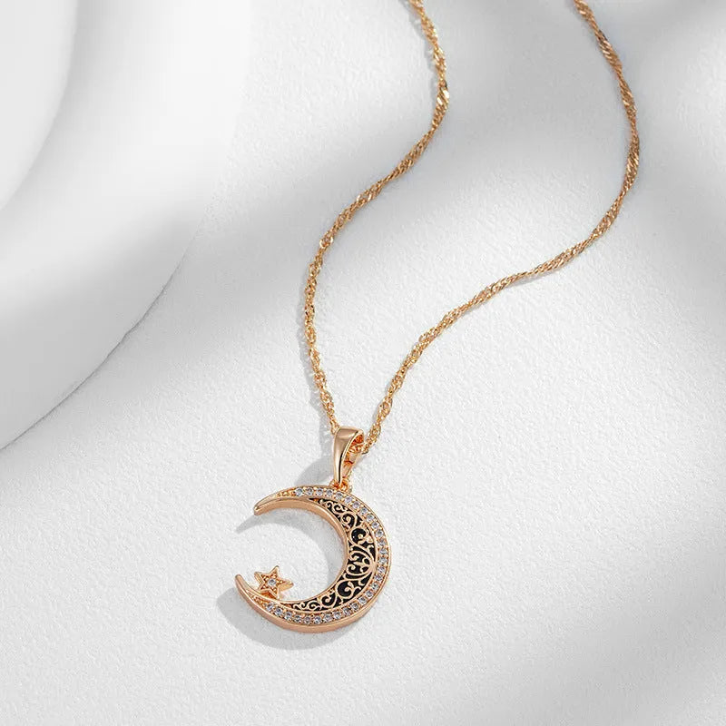 Rose gold star and moon necklace with zircon pendant on a water wave chain.