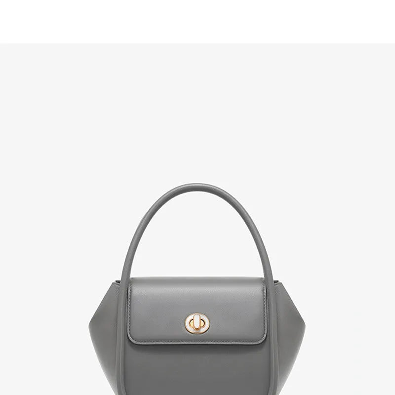 Women's wing-shaped leather tote bag with latch closure and cross-body strap in four colour options