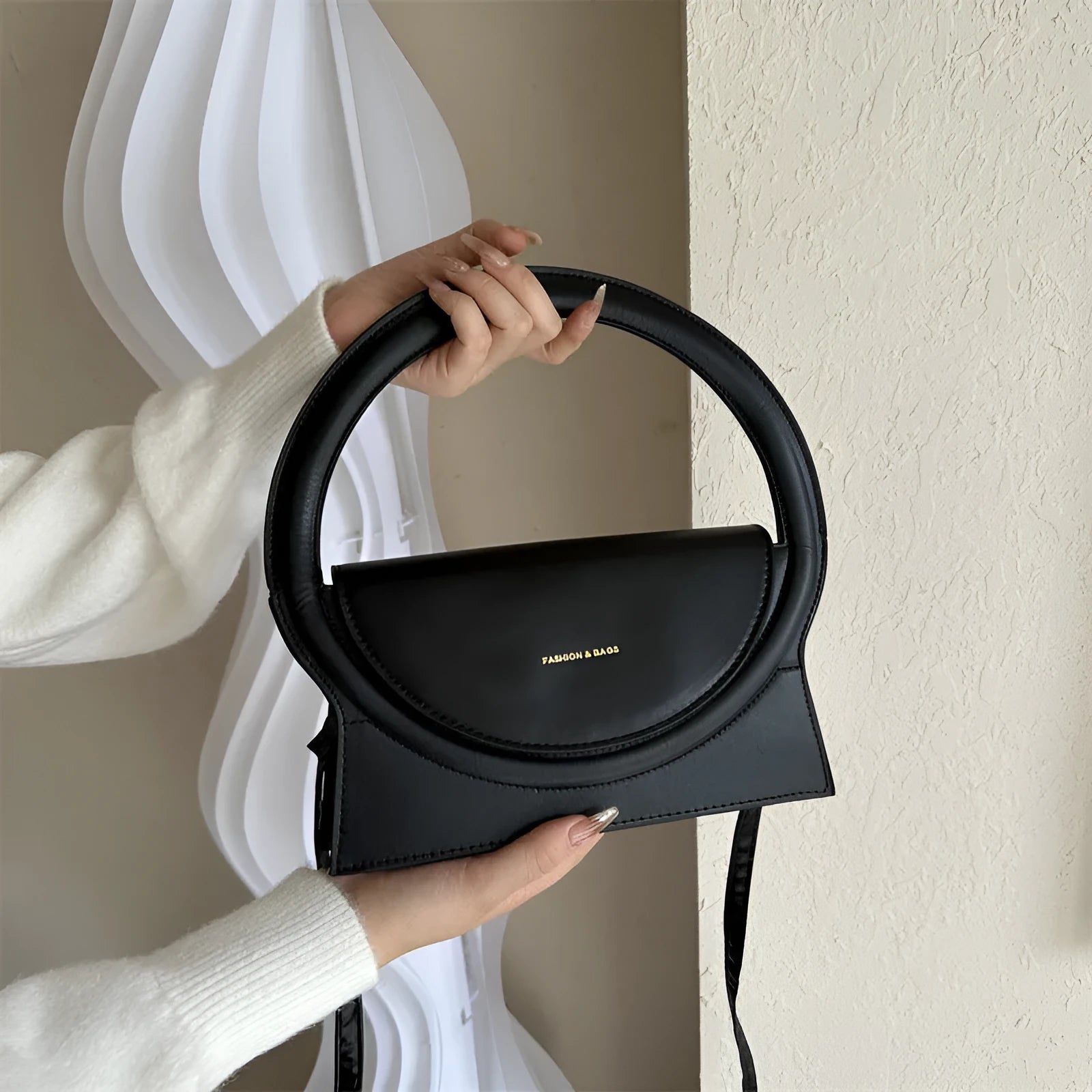 PU leather messenger bag in horizontal square shape with sandwich pockets and stitching details