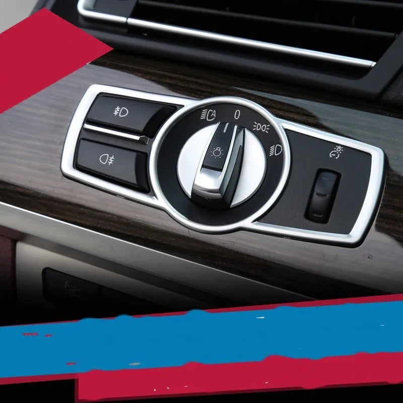 Silver ABS plastic decorative sticker for BMW headlight switch frame interior trim.