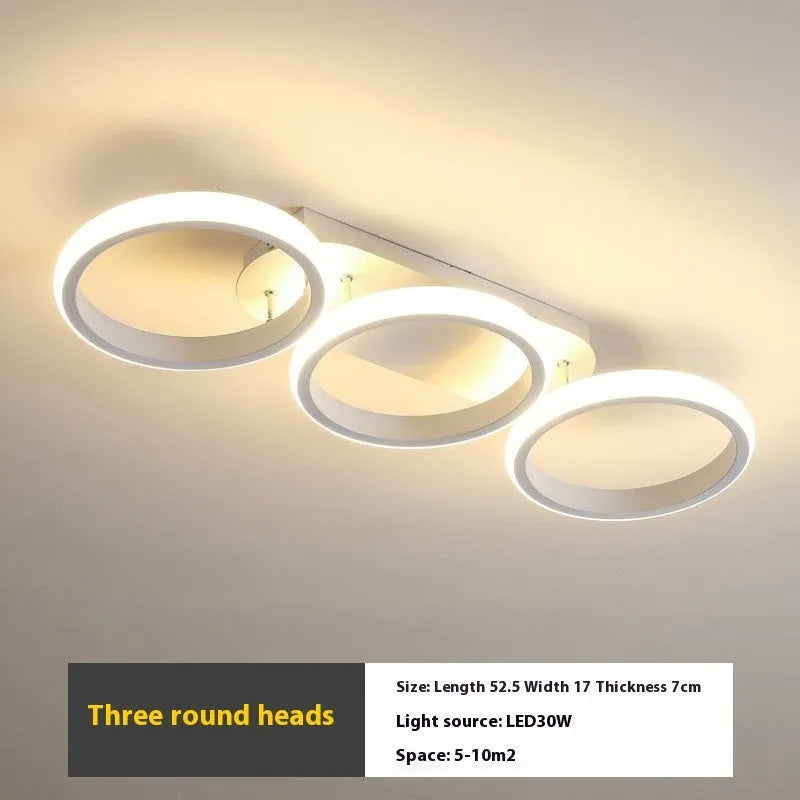Modern simplicity hallway LED ceiling light in black with three round shapes over a corridor