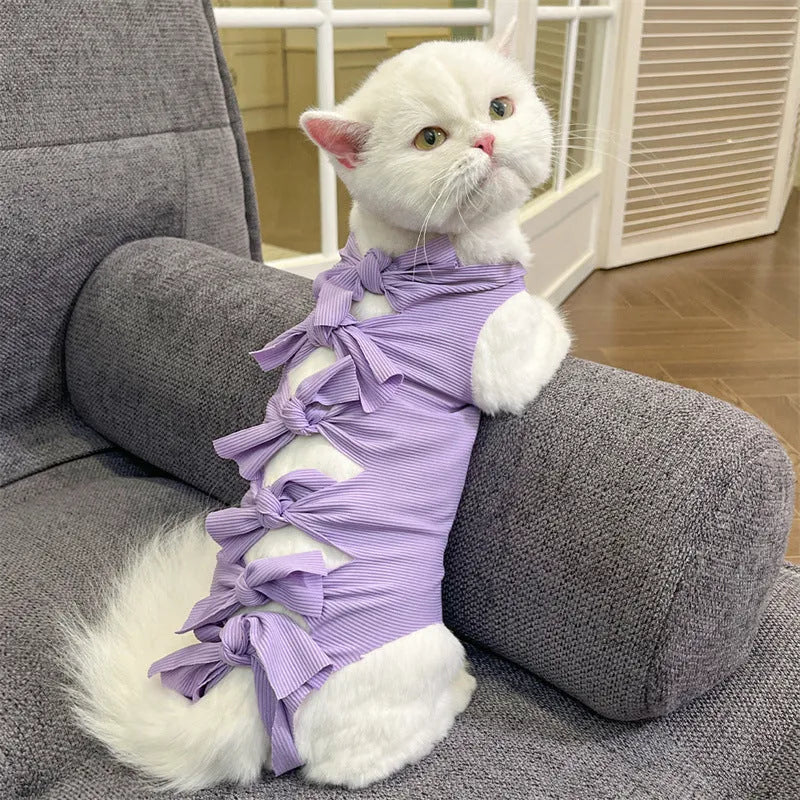 Adjustable lace-up cat sterilisation recovery suit in polyester, shown in various colours.