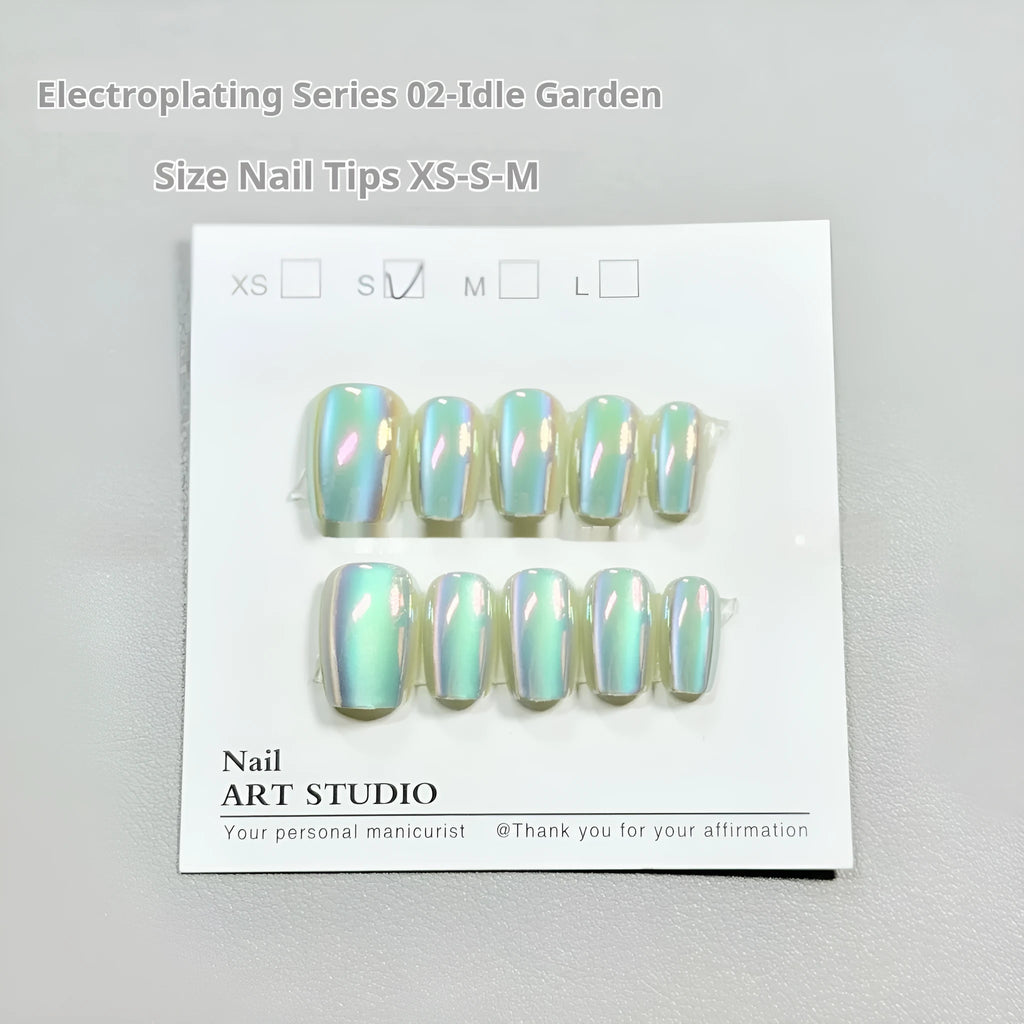 Electroplated Cat's Eye false nail wraps showing Aurora and solid colour designs in short ladder sizes XS, S, and M.