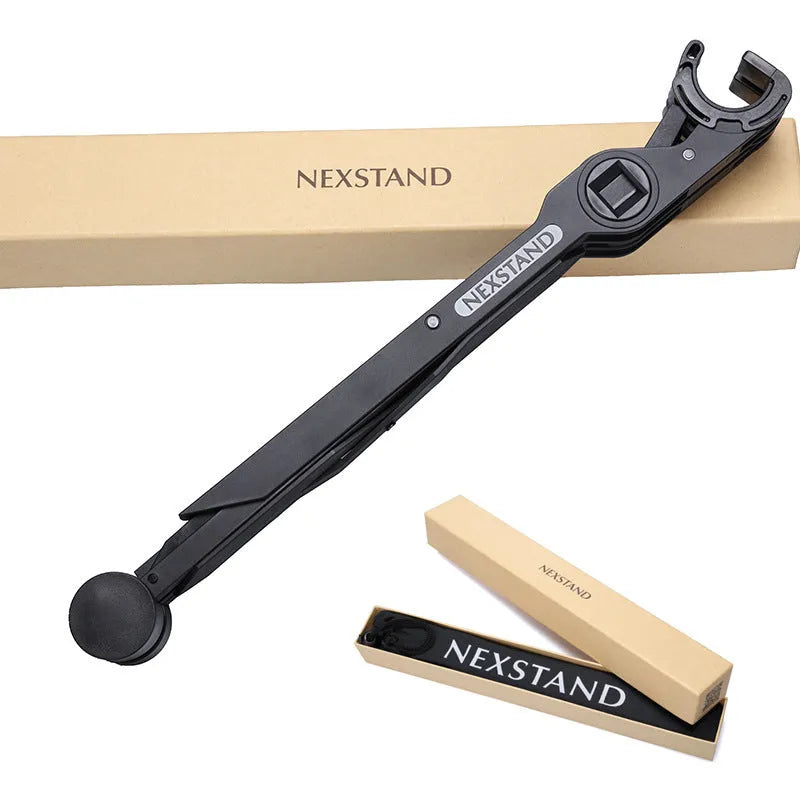 Black reinforced nylon portable folding laptop stand with 35.4cm width, shown in folded position.