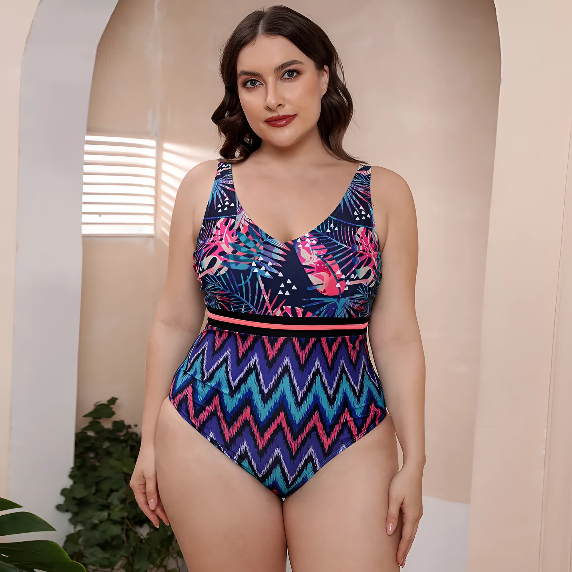 Women's printed spaghetti strap one-piece swimsuit in blue, white, and green patterns with vest style