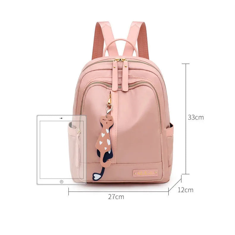 Women's black nylon backpack with double shoulder straps and organisational compartments