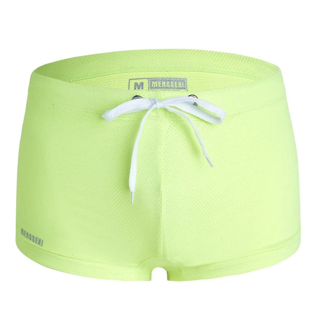 Men's low waist boxer style nylon swimming trunks in multiple solid colours