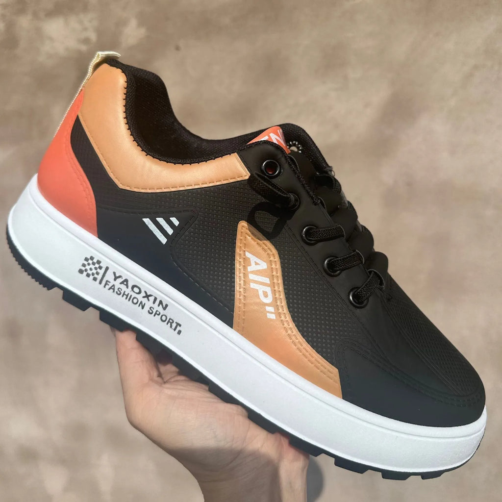 Men's white and black casual sports shoes with round toe, made from artificial PU.