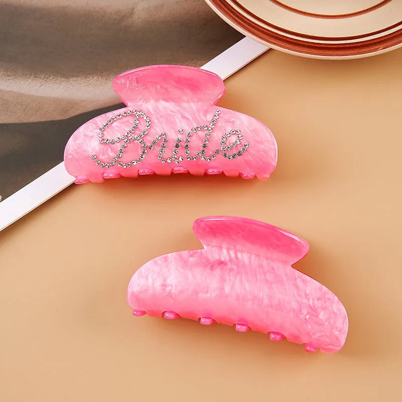 10cm long acrylic shower shark hair clip with diamond spot drill decoration in pink colour with back clip mechanism.