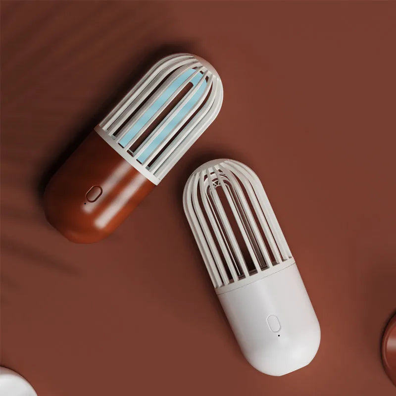 Portable capsule ultraviolet disinfection lamp in black, brown, green or white with dimensions 52x52x136mm