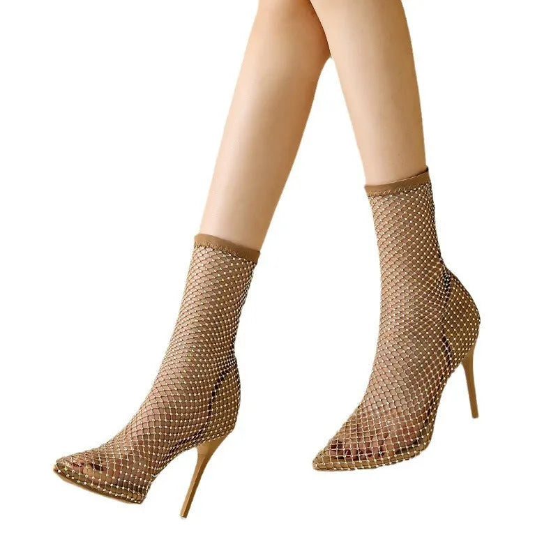 Gold women's high heel sandals with a mesh upper, pointed stiletto toe, and a thin heel.
