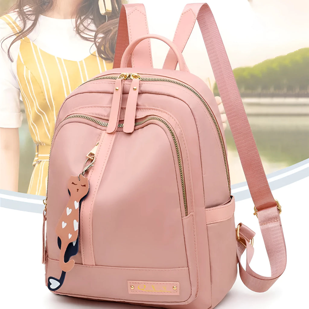 Women's black nylon backpack with double shoulder straps and organisational compartments