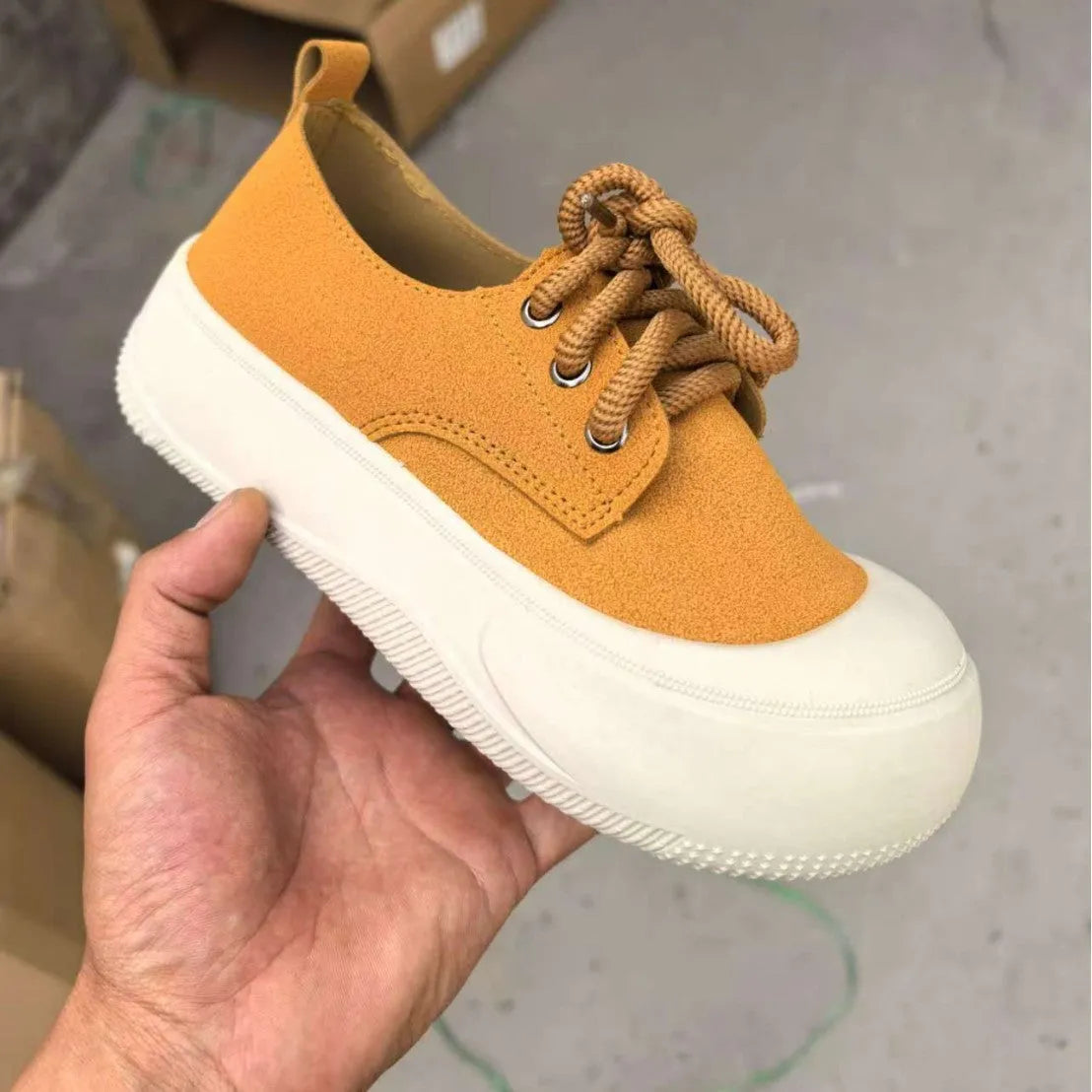 Women's camel suede platform loafers with 4cm heel, round toe, and front lace-up on a rubber sole.