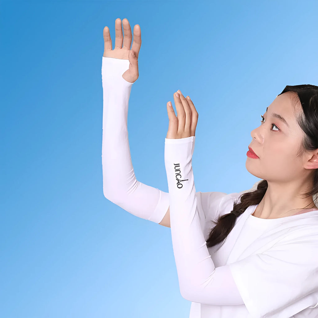 A person wearing a grey sun protection driving sleeve on their forearm, showing the open finger design.