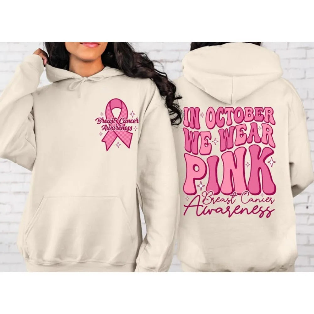 Pink breast cancer awareness pullover hoodie with retro art print and side seam pockets.