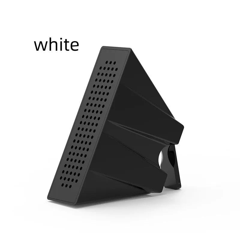 A small, coloured plastic phone amplifier holder holding a mobile phone on a desk.