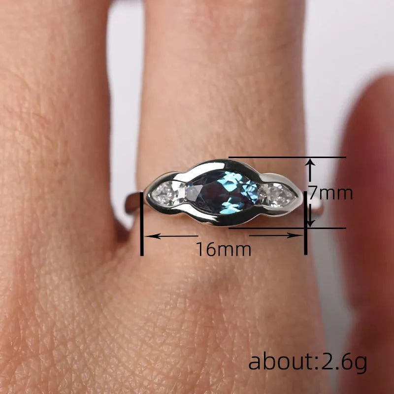 Geometric ellipse women's ring with white gold colour and inlaid zircon detailing on finger