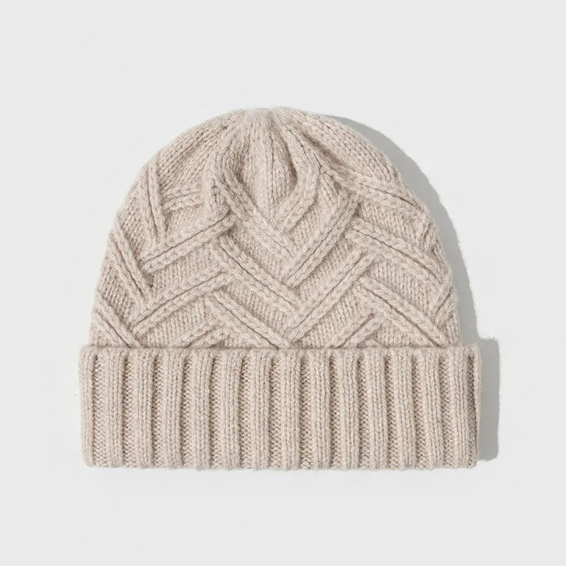 Woman wearing a wool knitted dome crown hat with a totem pattern in ankela red