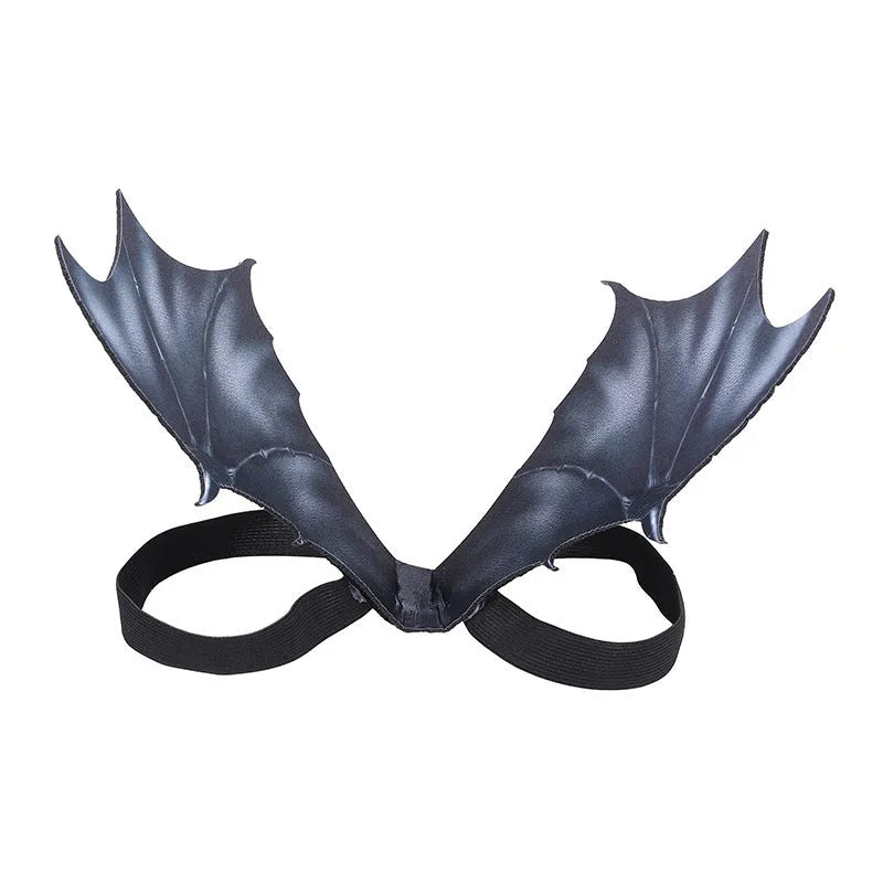 Black fabric bat wing costume for a pet dog or cat, showing elastic straps.