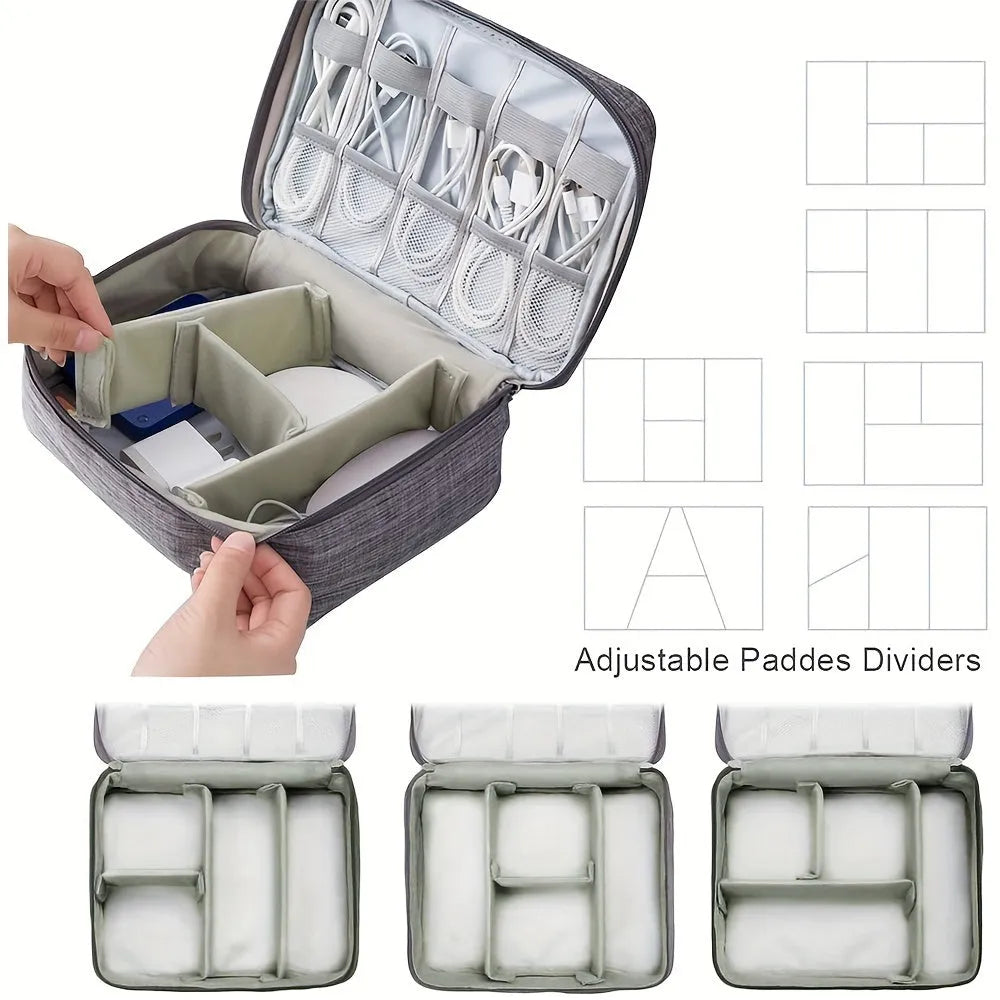 Black travel cable organiser bag open, showing mesh pockets, elastic loops, and removable padded dividers inside.