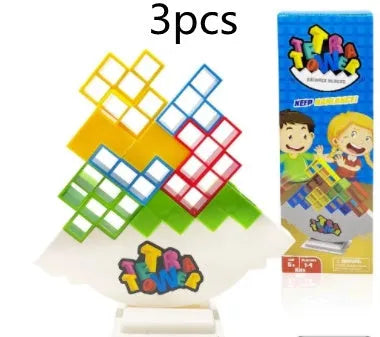 Balance stacking board game with 16 plastic coloured building blocks, base and chassis on a flat surface