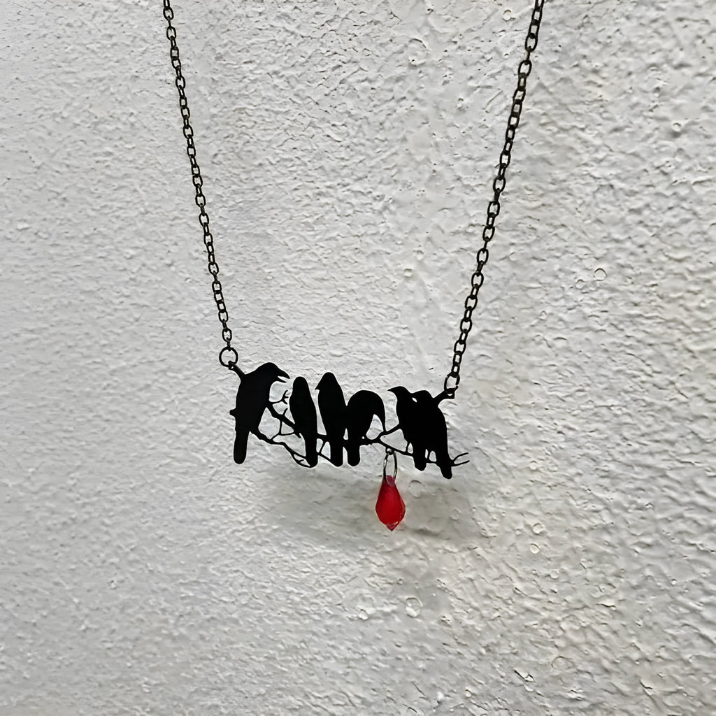 Black gothic style crow bird pendant on a cross chain necklace