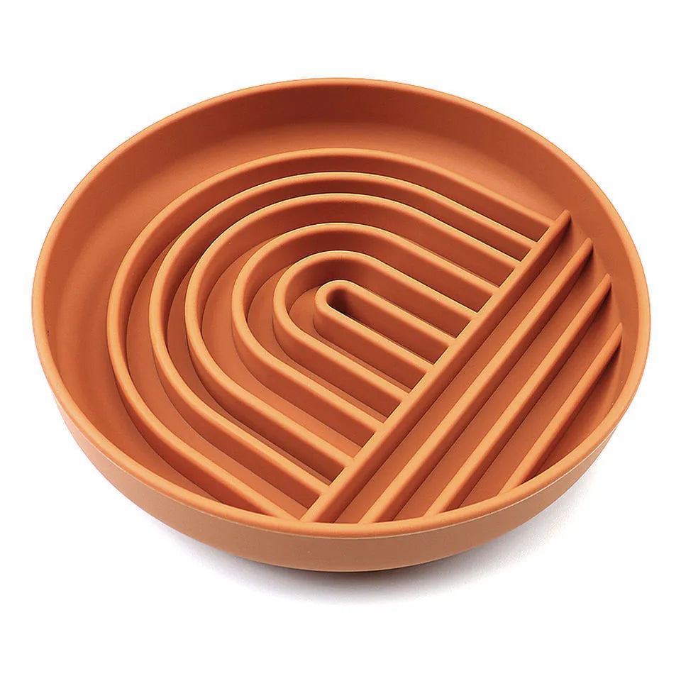 Silicone slow feeder dog bowl with textured ridges and nooks for slow eating, shown in assorted colours.