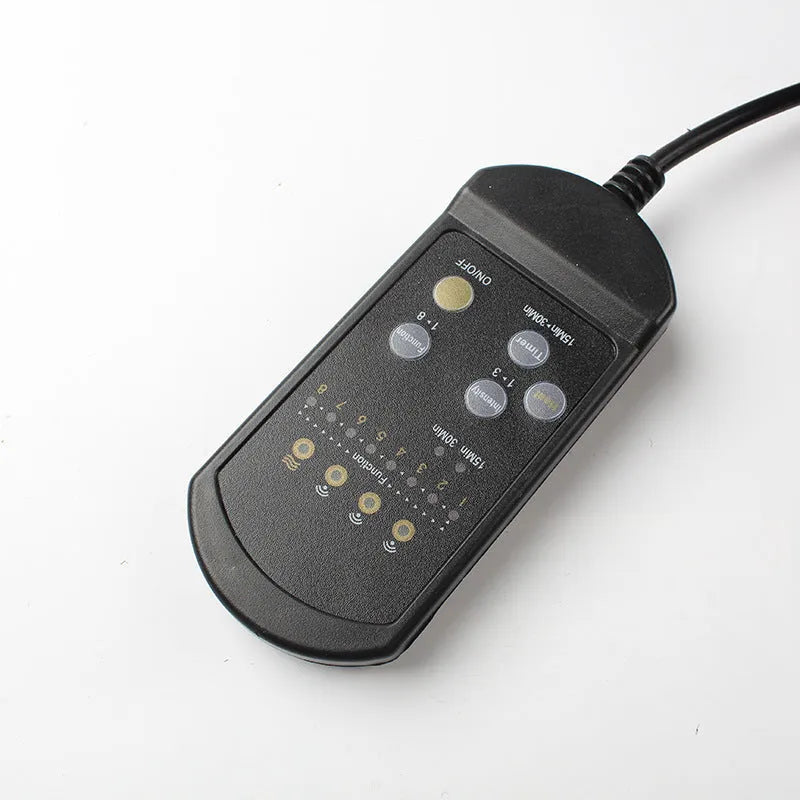 Black heating massage mat with infrared physiotherapy function and seat cushion on grey background