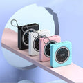 Compact alloy case mini power bank in pink, black, green, or white, showing multi-USB ports.