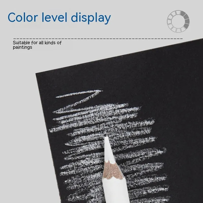 Three white charcoal sketching pencils with wooden barrels for highlighting artwork