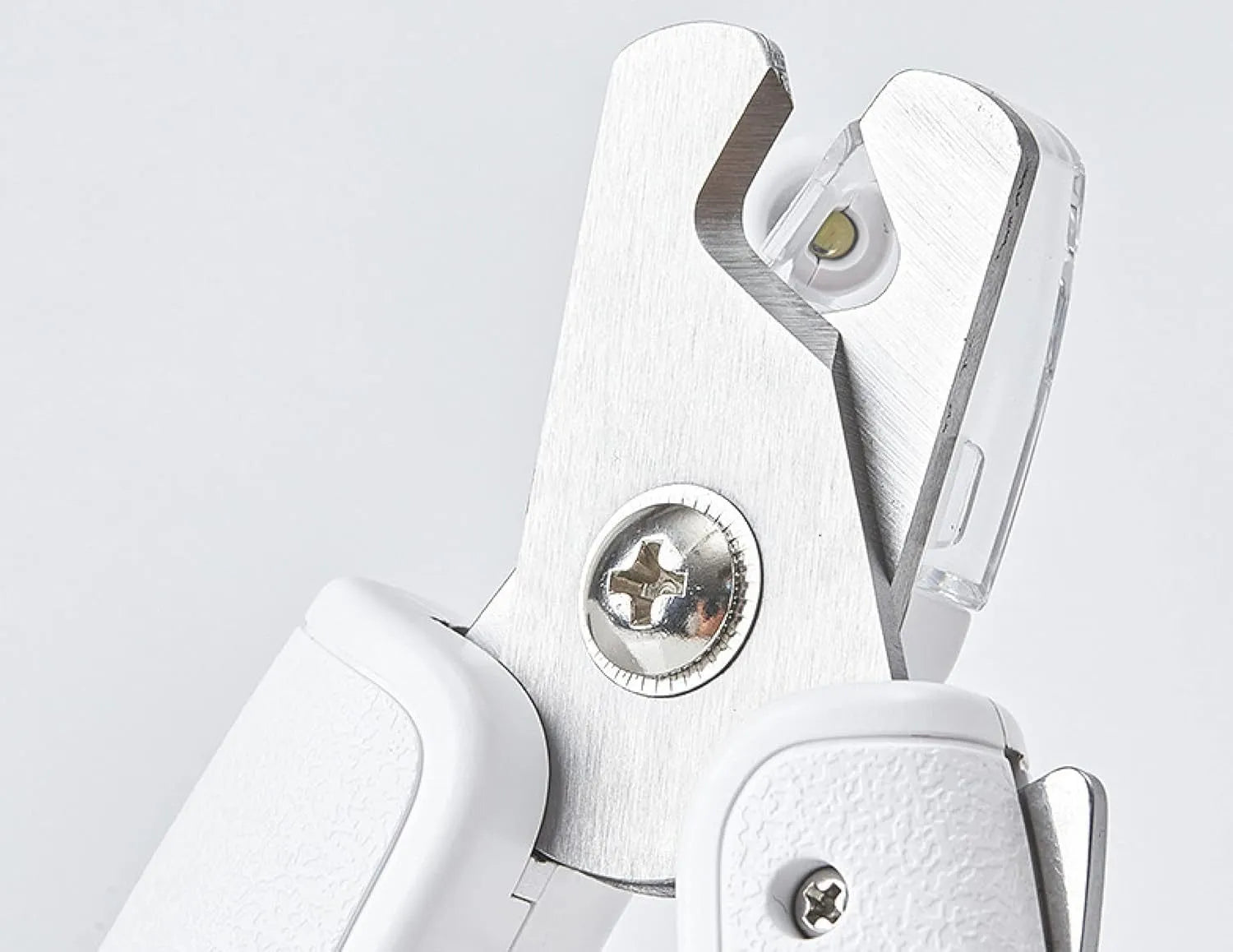 White pet nail clippers with LED light, transparent guard, and nail file for cats and dogs