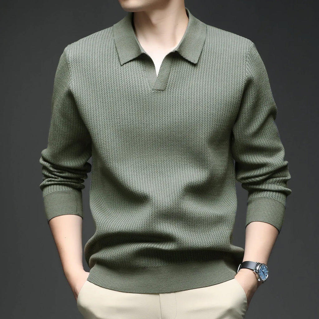 A man's loose-fitting casual pullover jumper in a neutral colour, shown on a model.