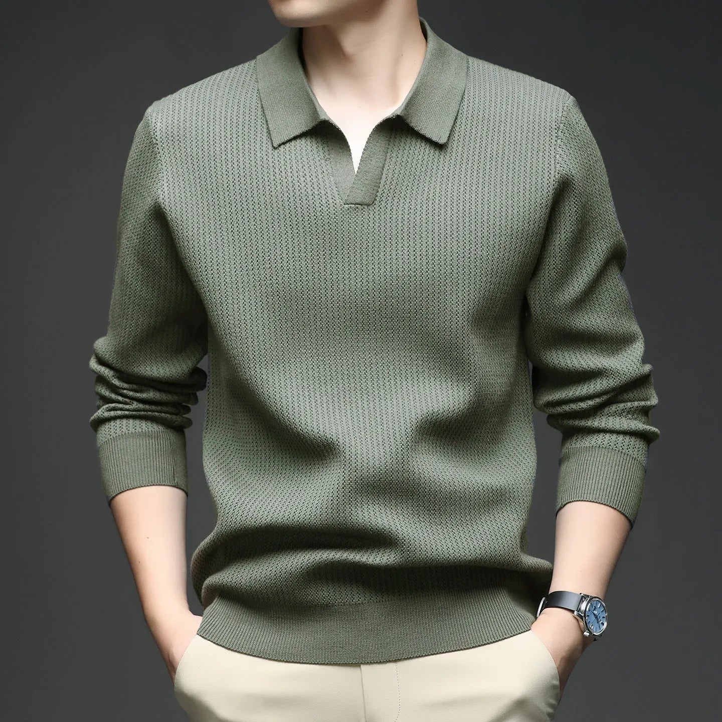 A man's loose-fitting casual pullover jumper in a neutral colour, shown on a model.