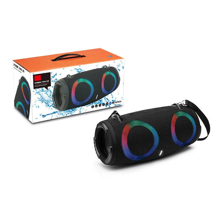 War Drum portable Bluetooth speaker with RGB coloured lights in outdoor setting