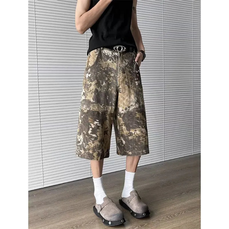 Yellow snake pattern camouflage cropped jeans on a neutral background