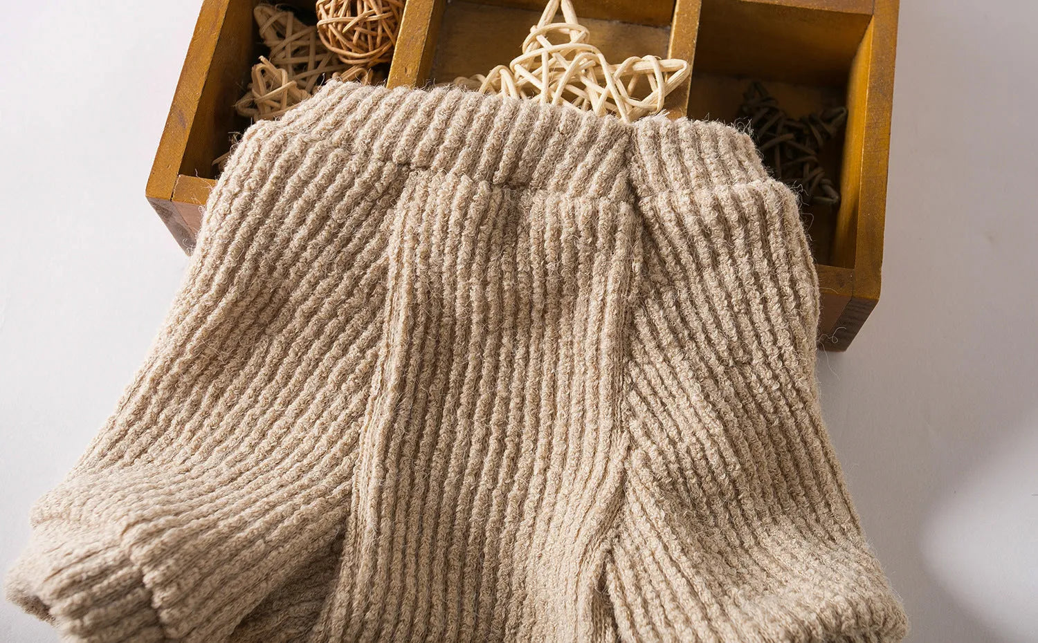 Brown cloth pullover sweater for small breed dog on model showing size fit
