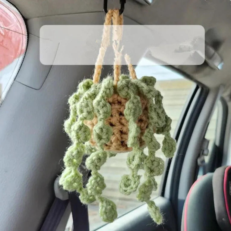 Green and white knitted rope car plant ornament with 8cm base and hanging rope.