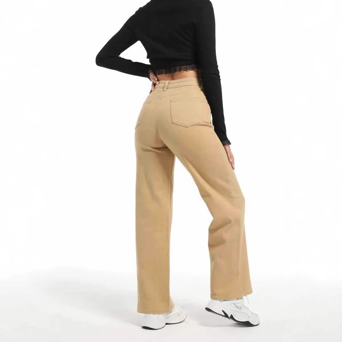 Women's straight leg jeans with wide leg silhouette in apricot colour showing high waist design