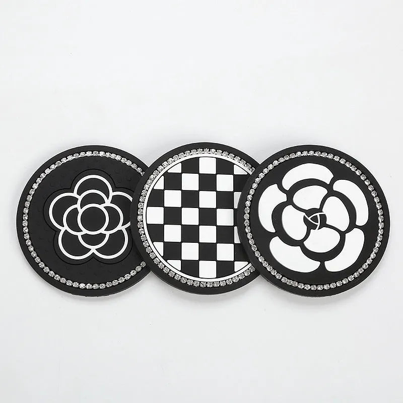 Black and white checkerboard PVC car cup mat inserted into a car door card slot.